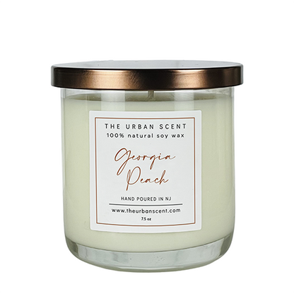 Georgia Peach soy candle with peach, spice, floral, and amber notes in a modern glass jar.