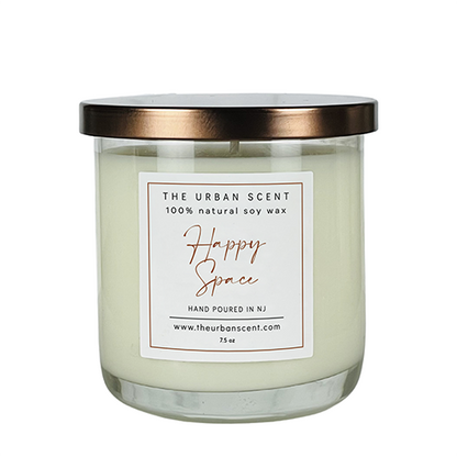 Happy Space soy candle with citrus, spice, and amber notes in a bright modern jar