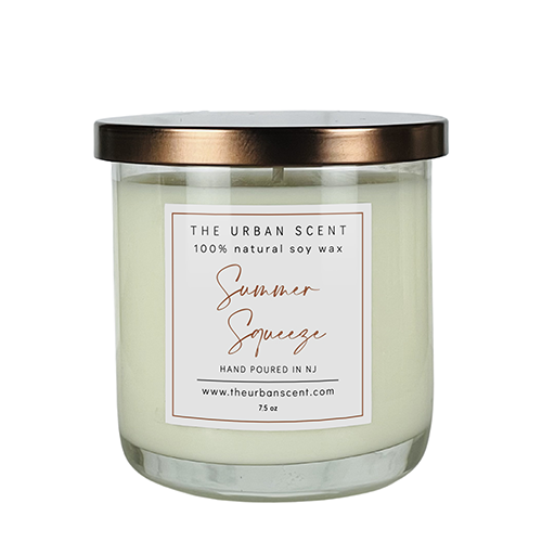 Summer Squeeze soy candle with lemon, berries, watermelon, and musk in a jar.