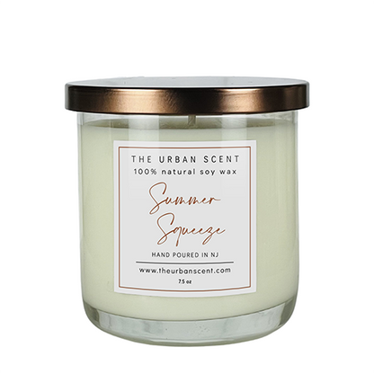 Summer Squeeze soy candle with lemon, berries, watermelon, and musk in a jar.