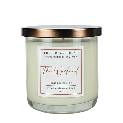 The Weekend soy candle with black pepper, lavender, and warm amber woods in a cozy modern jar.