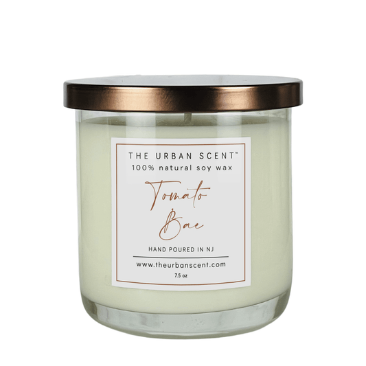 Tomato Bae scented candle by The Urban Scent in a minimalist glass jar featuring tomato leaf, basil, and lemon peel notes.