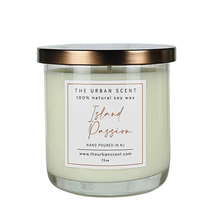 Island Passion soy candle with orange, apple, floral, and musk notes in a jar.